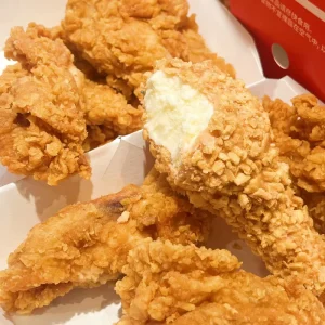 Chicken Drumstick with Vanilla Flavor Ice Cream Coated in Cookie Crumbs and Chocolate Dairy Product